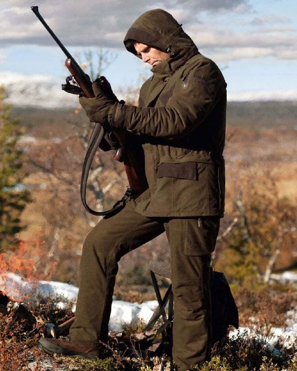 Hunting Green Coloured Harkila Visent Jacket on outdoor background #colour_hunting-green