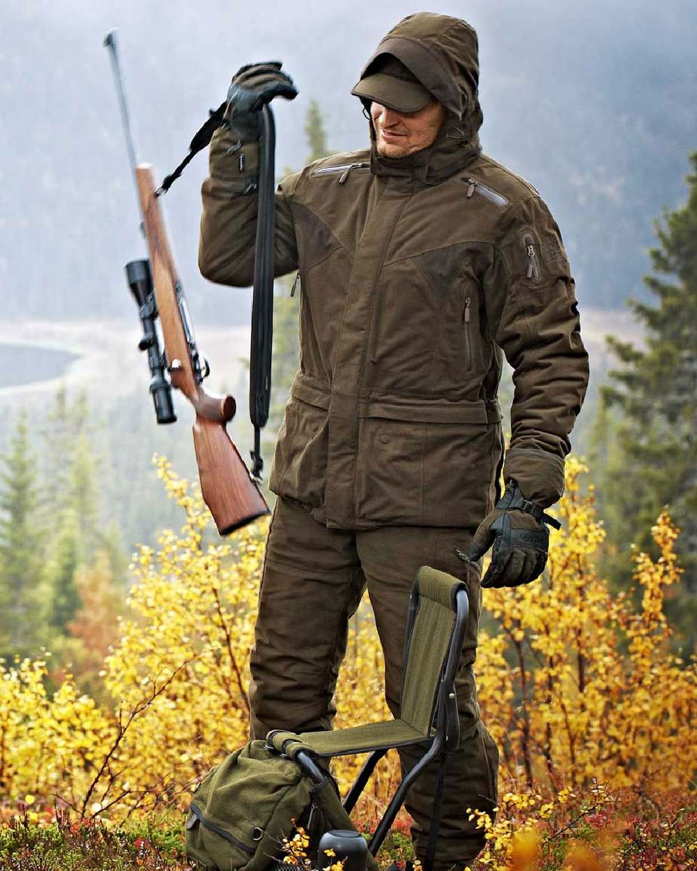 Hunting Green Coloured Harkila Visent Jacket on outdoor background #colour_hunting-green