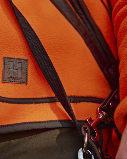 Orange Blaze Coloured Harkila Wildboar Pro Blaze Fleece Jacket on forest background #colour_orange-blaze