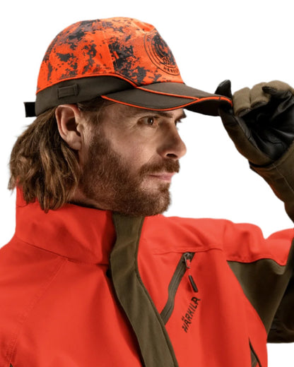 AXIS Orange Blaze Shadow Brown Coloured Harkila Wildboar Pro Light Cap on white background #colour_axis-orange-blaze-shadow-brown