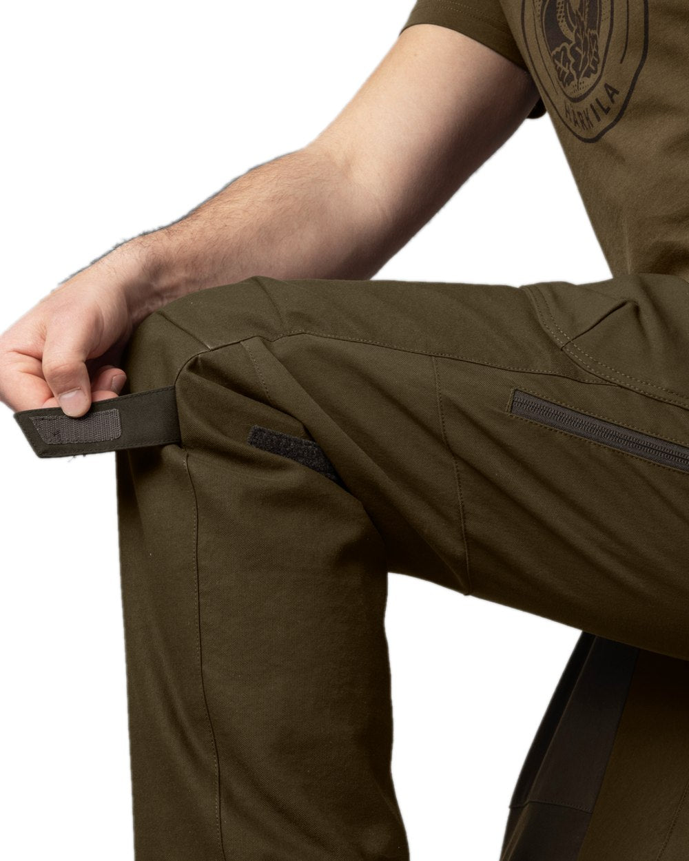 Willow Green Coloured Harkila Wildboar Pro Move Trousers on white background #colour_willow-green
