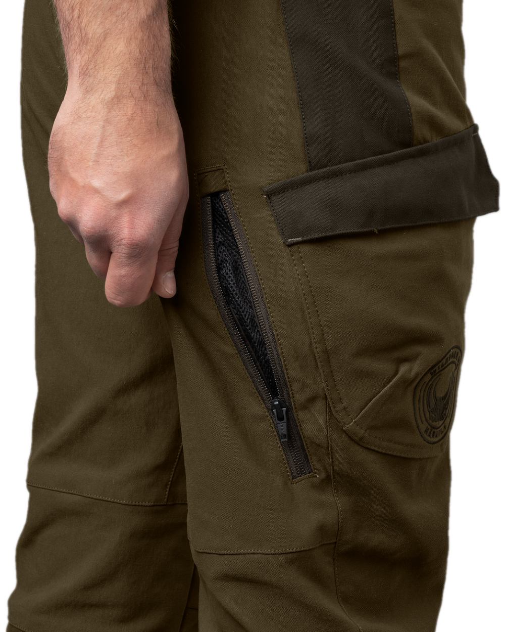 Willow Green Coloured Harkila Wildboar Pro Move Trousers on white background #colour_willow-green