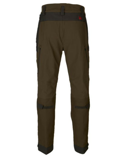 Willow Green Coloured Harkila Wildboar Pro Move Trousers on white background #colour_willow-green