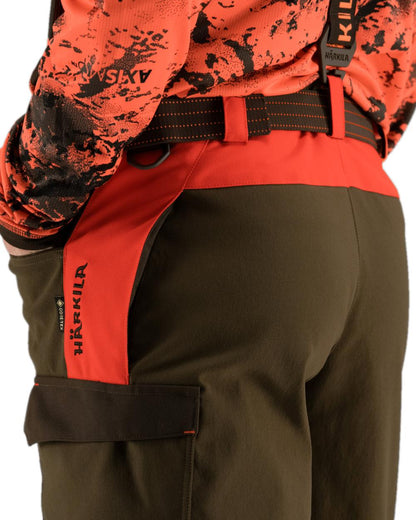Wildboar Orange Willow Green Coloured Harkila Wildboar Pro Trousers on white background #colour_wildboar-orange-willow-green