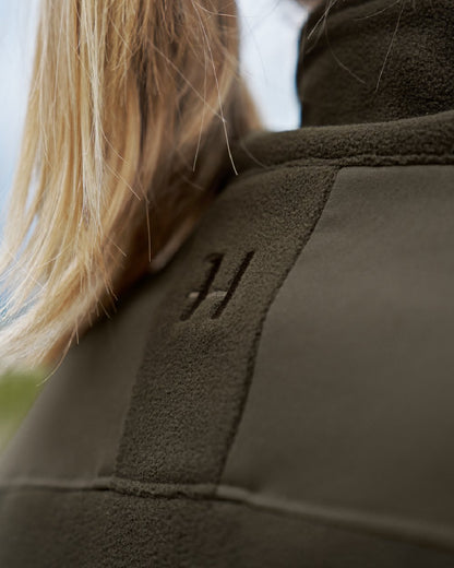 Hunting Green Willow Green Coloured Harkila Womens Fjell Fleece Jacket on blurry background #colour_hunting-green-willow-green