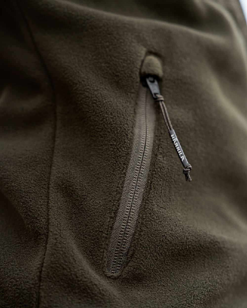 Hunting Green Willow Green Coloured Harkila Womens Fjell Fleece Jacket on blurry background #colour_hunting-green-willow-green