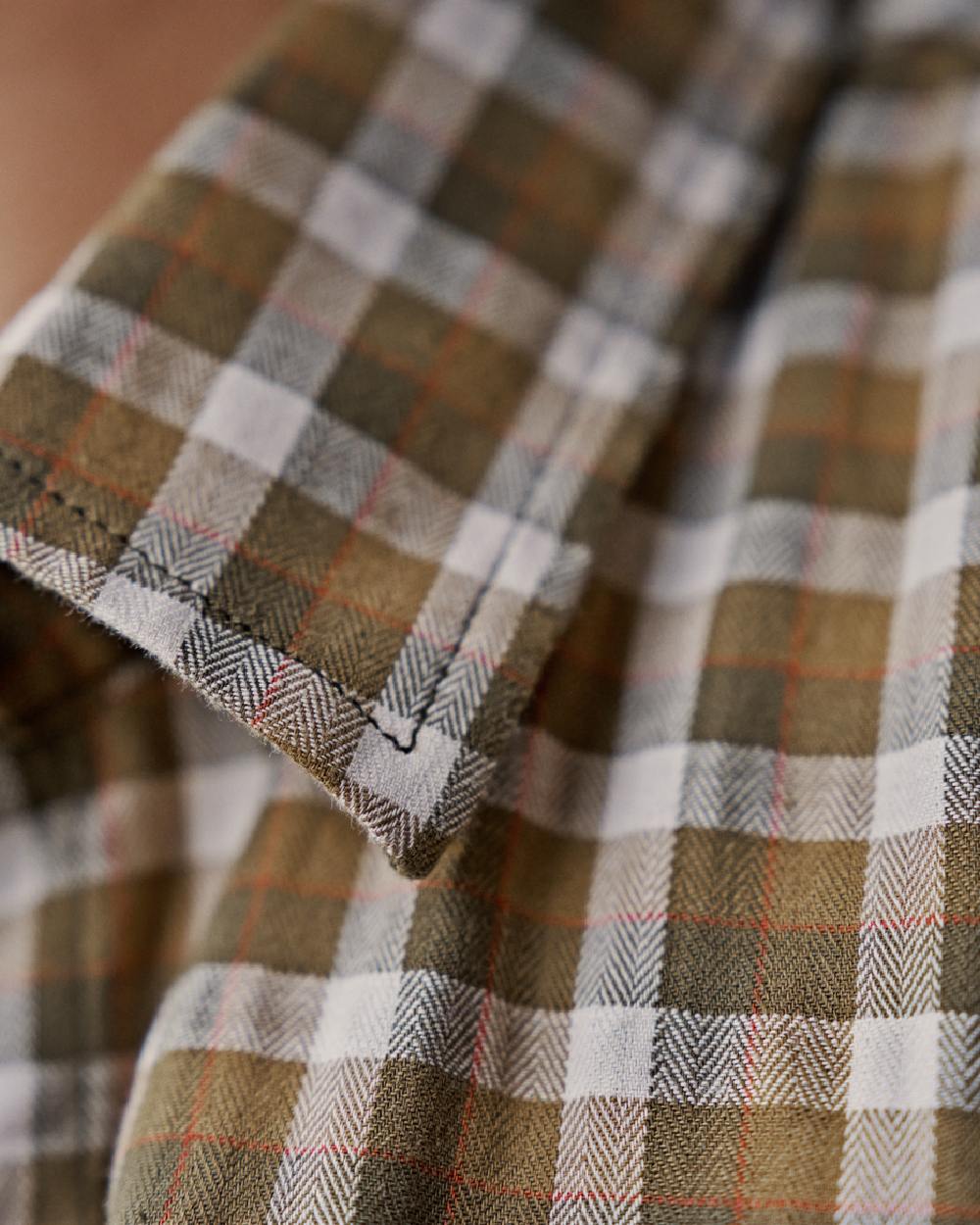 Dark Olive Check Coloured Harkila Womens Fjell Long Sleeve Shirt on blurry background #colour_dark-olive-check