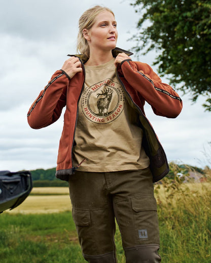 Dark Olive Arabian Spice Coloured Harkila Womens Kamko Reversible Windstopper Fleece Jacket on outdoor background #colour_dark-olive-arabian-spice