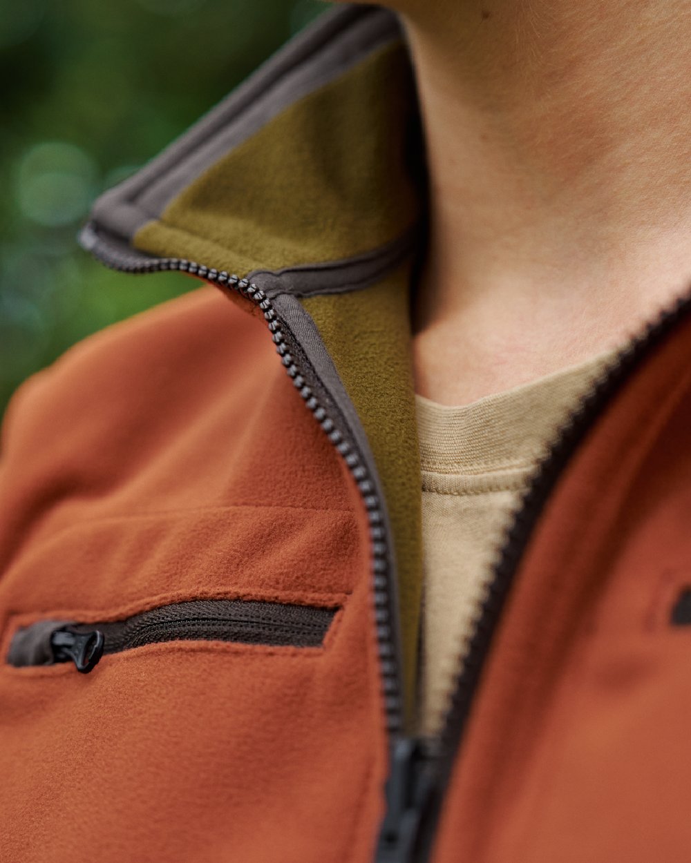 Dark Olive Arabian Spice Coloured Harkila Womens Kamko Reversible Windstopper Fleece Jacket on outdoor background #colour_dark-olive-arabian-spice