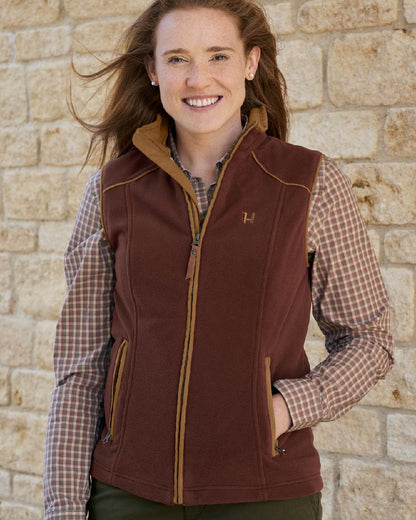 Burgundy Coloured Harkila Womens Sandhem 200 Fleece Waistcoat on outdoor background #colour_burgundy