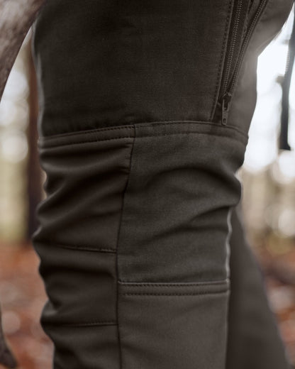 Shadow Brown Deep Brown coloured Harkila Womens Scandinavian Trousers on woodland background #colour_shadow-brown-deep-brown