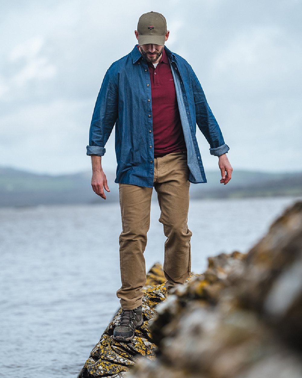Dark Wash Coloured Hoggs of Fife Archerfield Denim Shirt on coastal background #colour_dark-wash