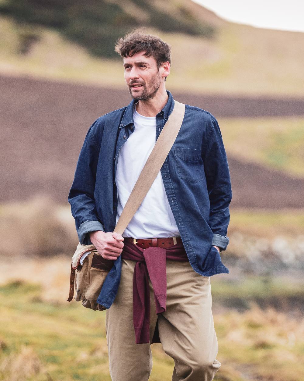 Dark Wash Coloured Hoggs of Fife Archerfield Denim Shirt on blurry background #colour_dark-wash