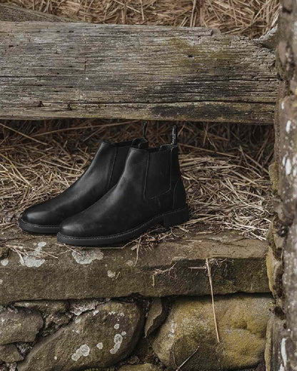 Black Coloured Hoggs of Fife Banff Country Dealer Boots on grass background #colour_black