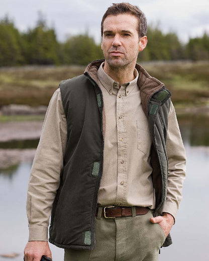 Loden Green Coffee Coloured Hoggs of Fife Breezer II Reversible Bodywarmer on lake background #colour_loden-green-coffee