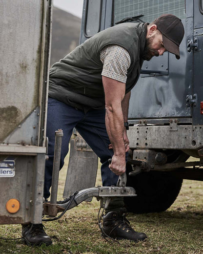 Loden Green Coffee Coloured Hoggs of Fife Breezer II Reversible Bodywarmer on truck background #colour_loden-green-coffee
