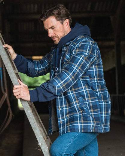 Navy Gold Coloured Hoggs of Fife Brunton Fleece Shacket on indoor background #colour_navy-gold