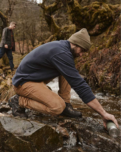 Harvest Coloured Hoggs of Fife Cairnie Comfort Stretch Cord Trousers on mountain background #colour_harvest