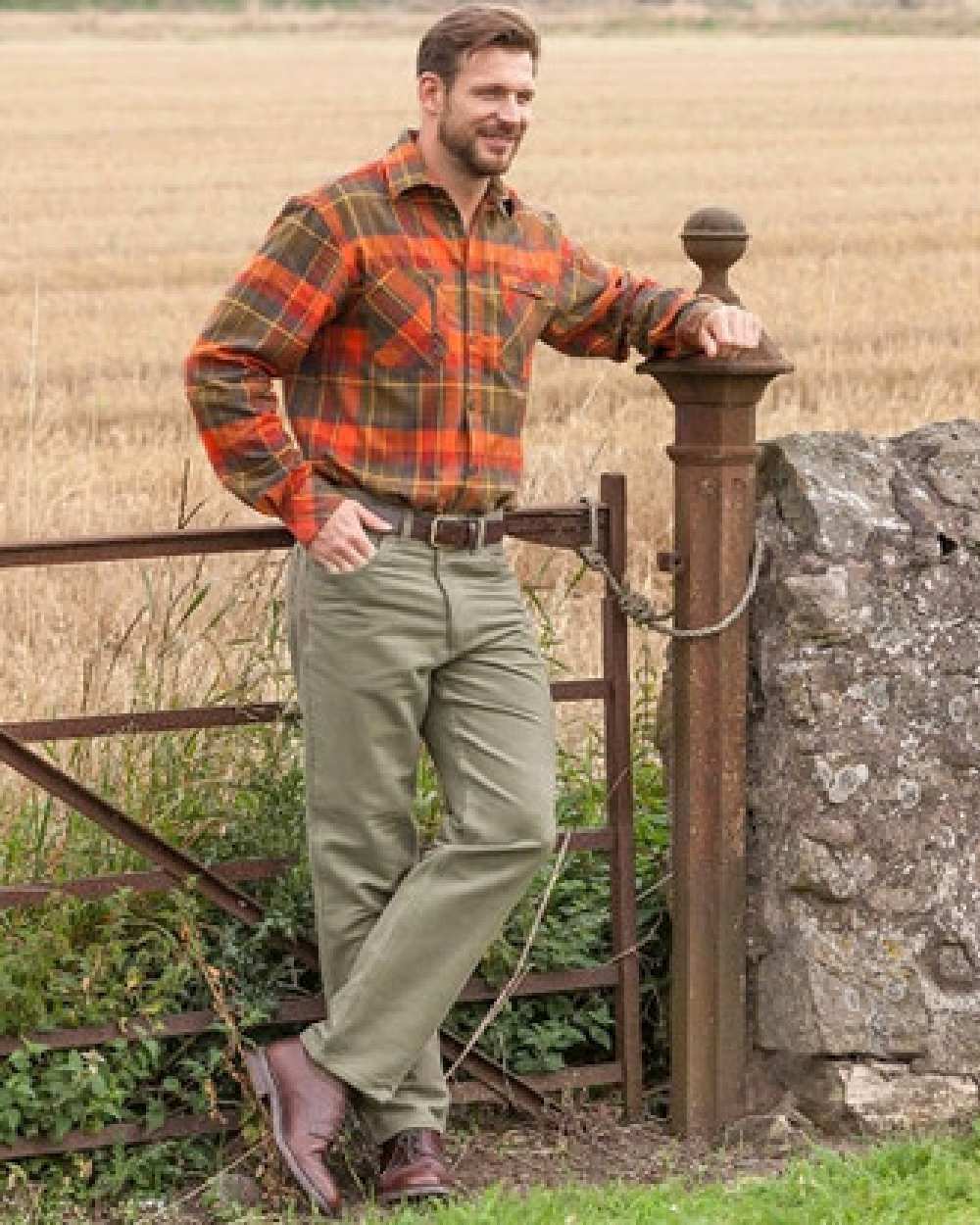 Dried Moss Coloured Hoggs of Fife Carrick Stretch Technical Moleskin Trousers on farm background #colour_dried-moss