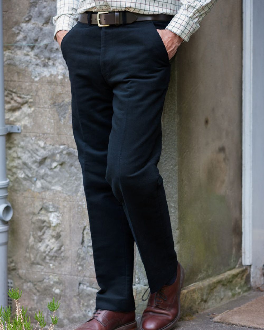 Navy Coloured Hoggs of Fife Carrick Stretch Technical Moleskin Trousers on wall background #colour_navy