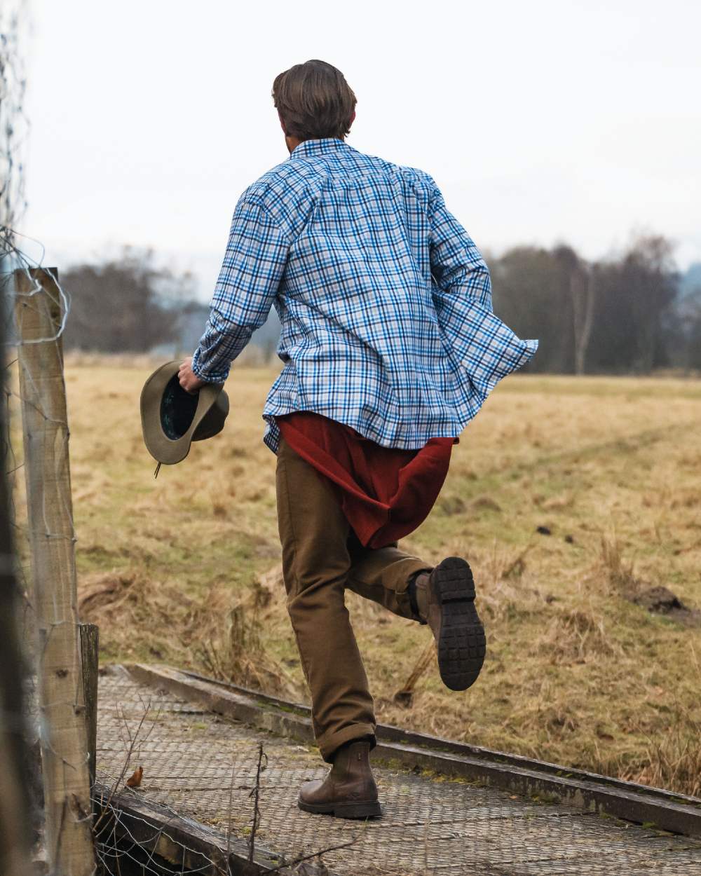Dried Moss Coloured Hoggs of Fife Carrick Technical Stretch Moleskin Jeans on farm background #colour_dried-moss