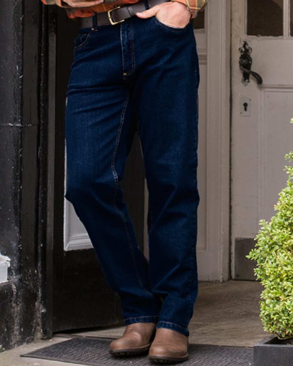 Dark Indigo Coloured Hoggs of Fife Clyde Comfort Denim Jeans on door background #colour_dark-indigo