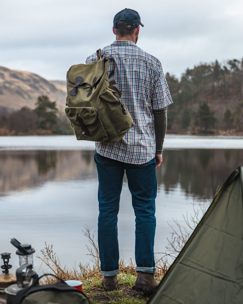 Dark Indigo Coloured Hoggs of Fife Clyde Comfort Denim Jeans on lake background #colour_dark-indigo
