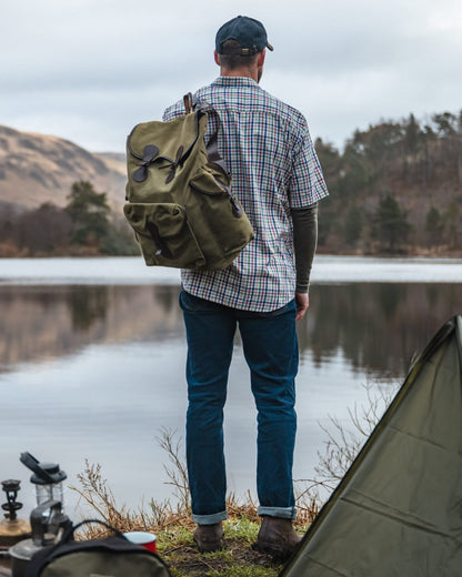 Dark Indigo Coloured Hoggs of Fife Clyde Comfort Denim Jeans on lake background #colour_dark-indigo