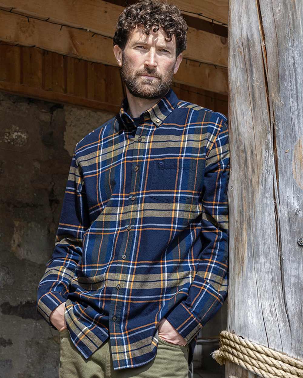 Navy Coloured Hoggs of Fife Coll Cotton Twill Check Shirt on wall background #colour_navy