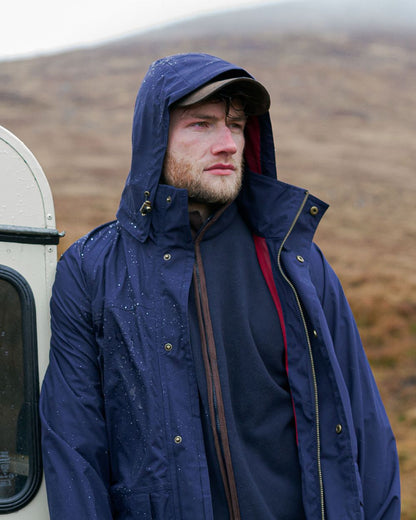 Navy Coloured Hoggs of Fife Culloden Waterproof Field Jacket on  mountain background #colour_navy