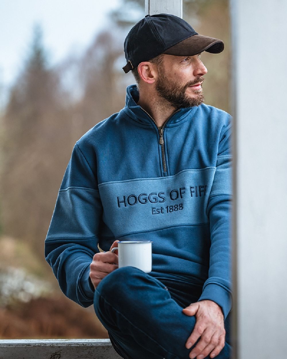 Sea Blue Vintage Blue Coloured Hoggs of Fife Dumfries 1888 Mens Quarter Zip Sweatshirt on blurry background #colour_sea-blue-vintage-blue