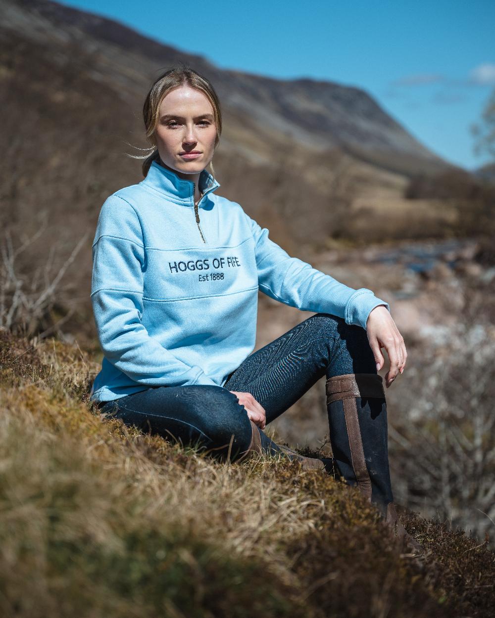 Plain Blue Coloured Hoggs of Fife Dumfries 1888 Womens Quarter Zip Sweatshirt on forest background #colour_plain-blue