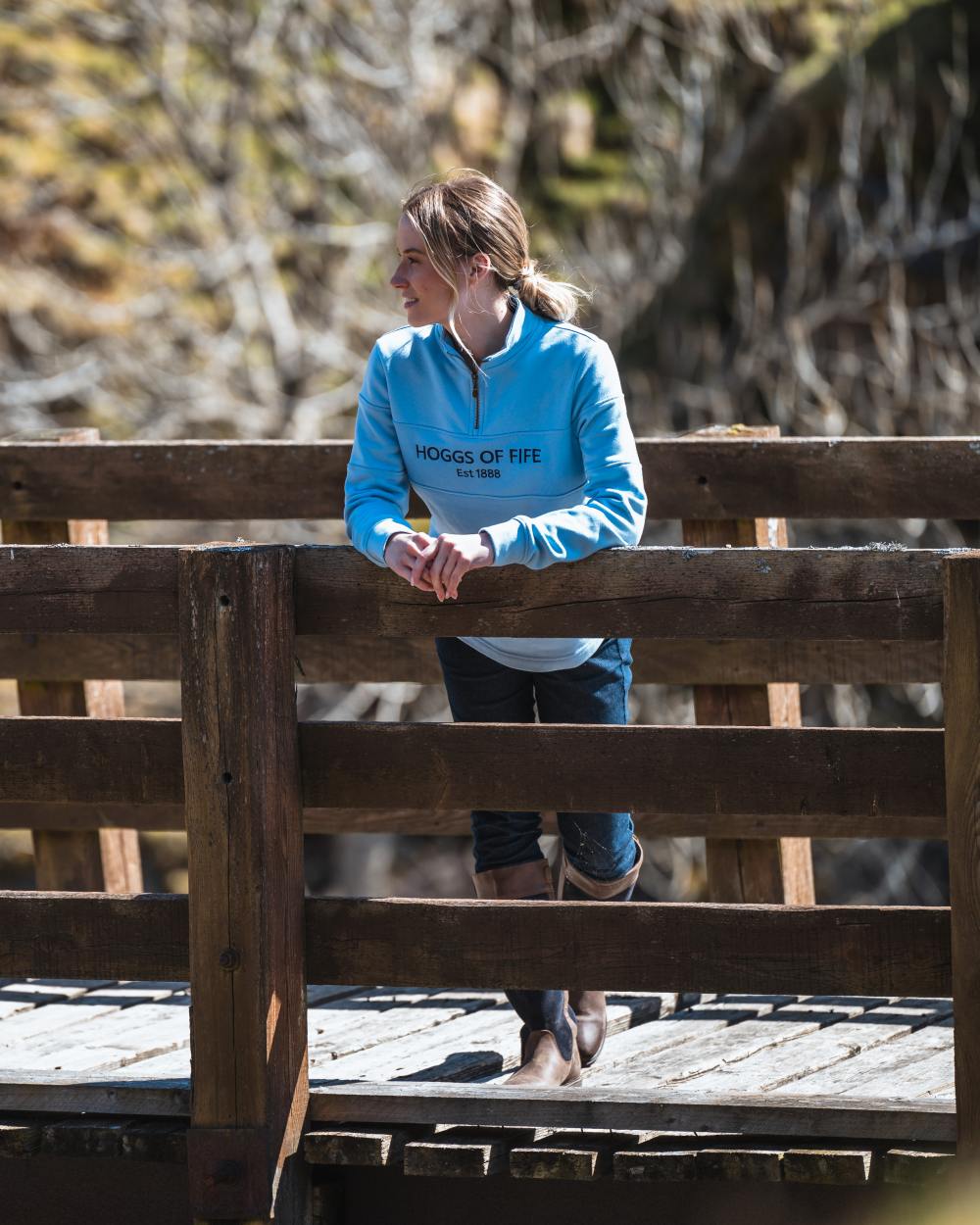 Plain Blue Coloured Hoggs of Fife Dumfries 1888 Womens Quarter Zip Sweatshirt on bridge background #colour_plain-blue