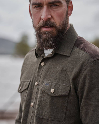 Loden Marl Coloured Hoggs of Fife Dunvegan Flannel Shirt on blurry background #colour_loden-marl