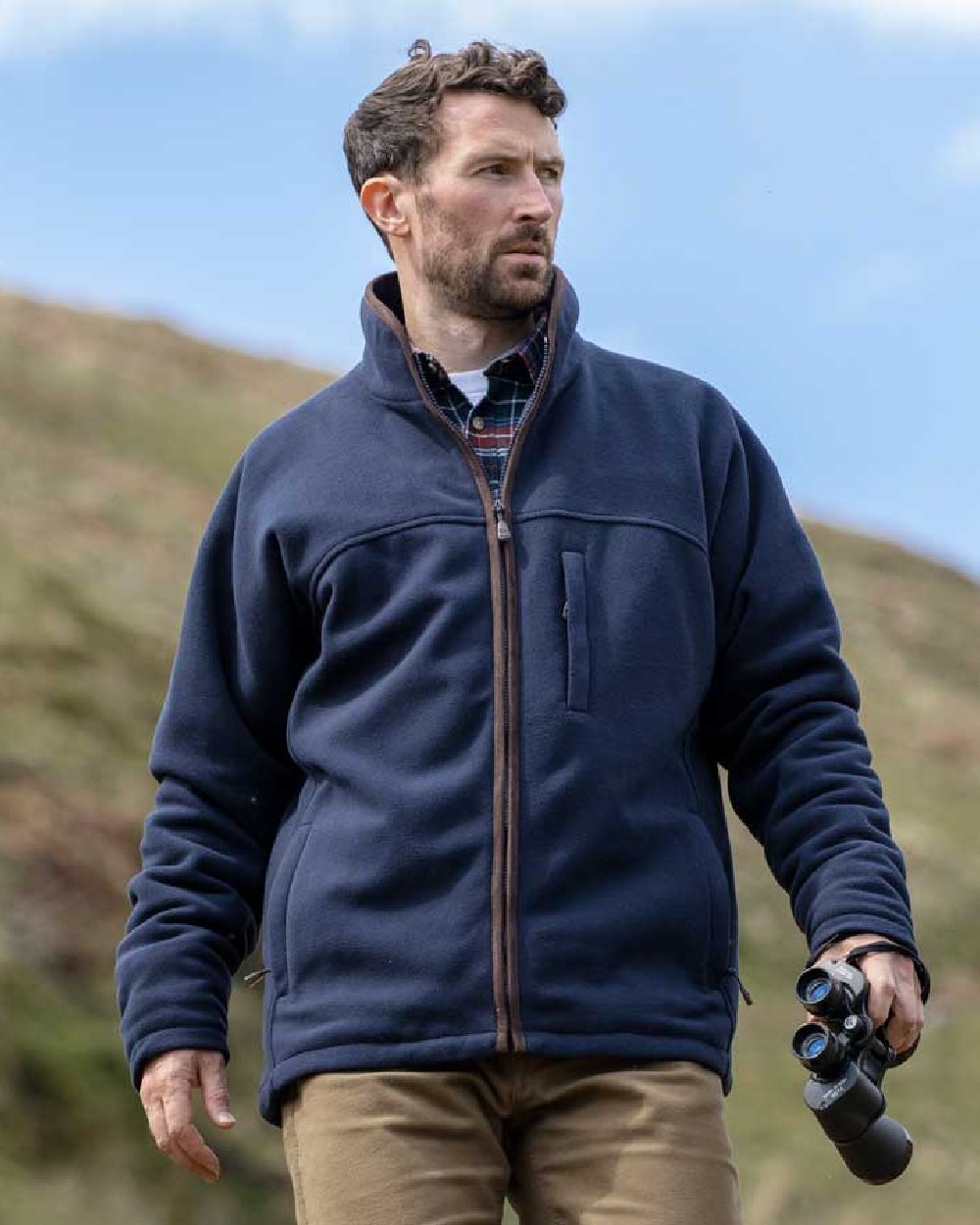 Navy Coloured Hoggs of Fife Ghillie II Padded Waterproof Fleece Jacket on blurry mountain background #colour_navy