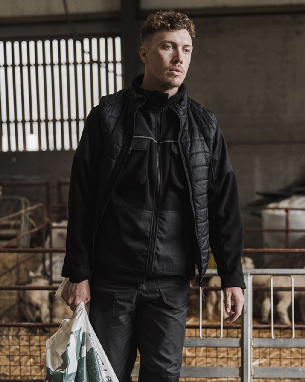 Black Coloured Hoggs of Fife Granite Bonded Fleece Jacket on barn background #colour_black