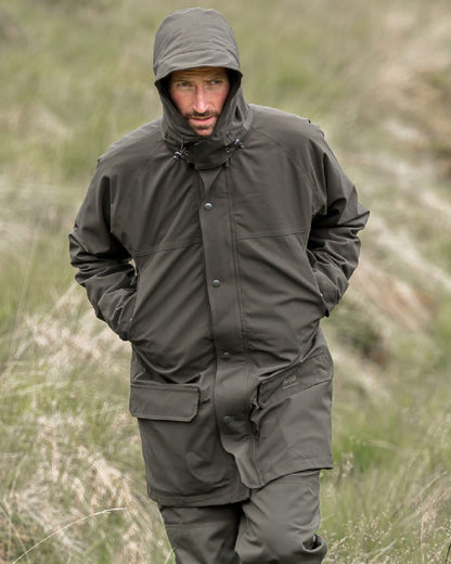 Green Coloured Hoggs of Fife Green King II Waterproof Jacket on grass background #colour_green