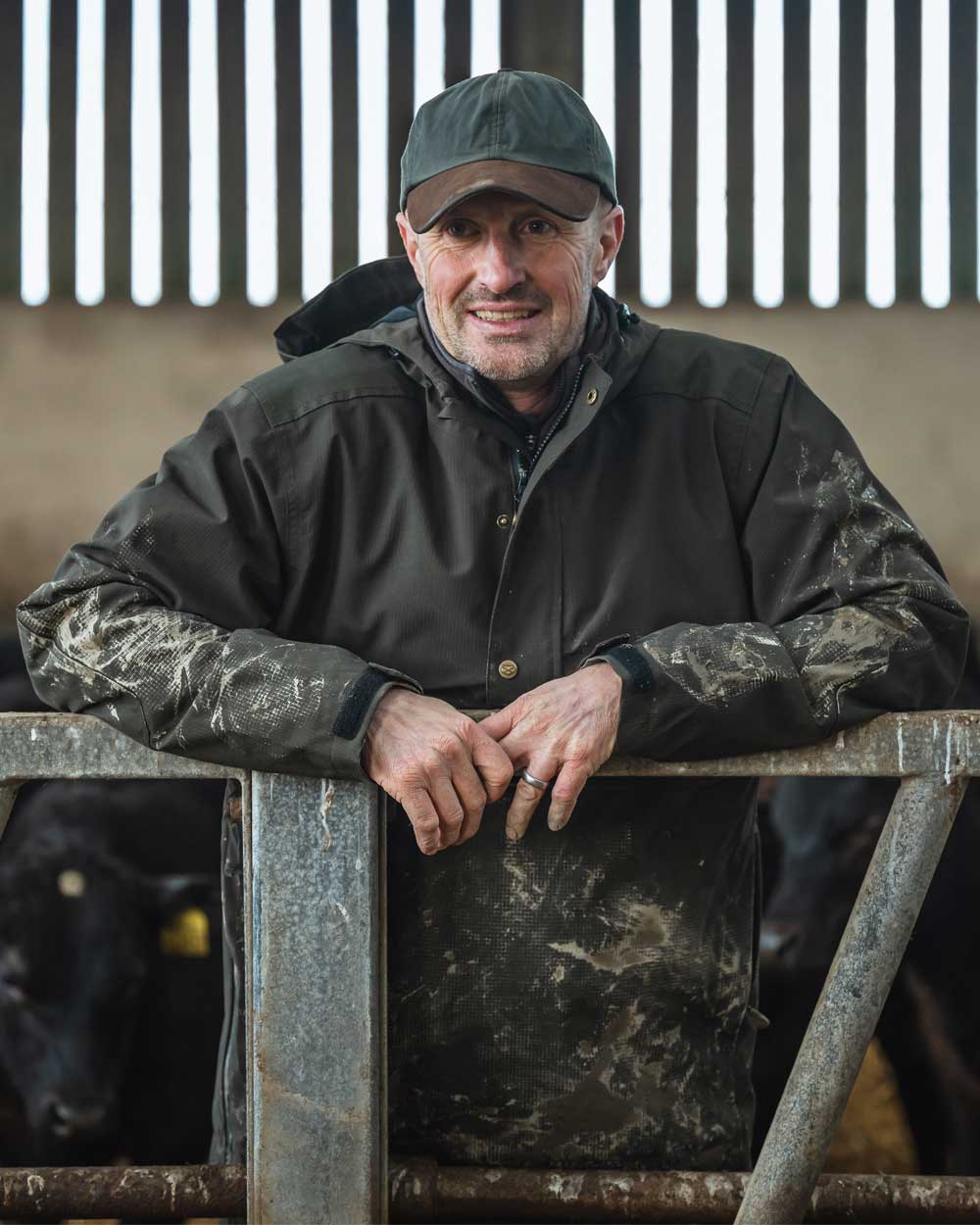 Green Coloured Hoggs of Fife Green King II Waterproof Smock on barn background #colour_green