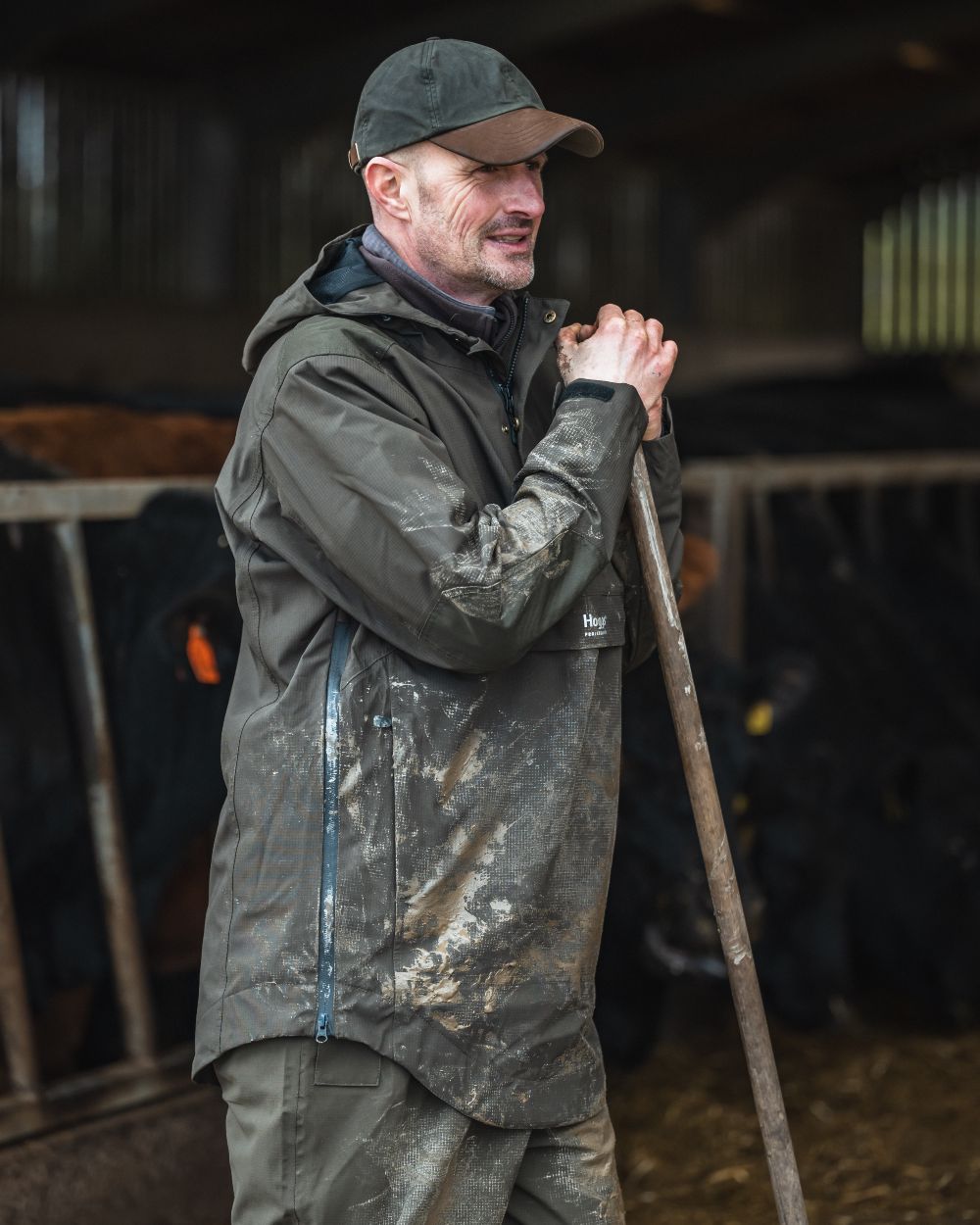 Green Coloured Hoggs of Fife Green King II Waterproof Smock on barn background #colour_green