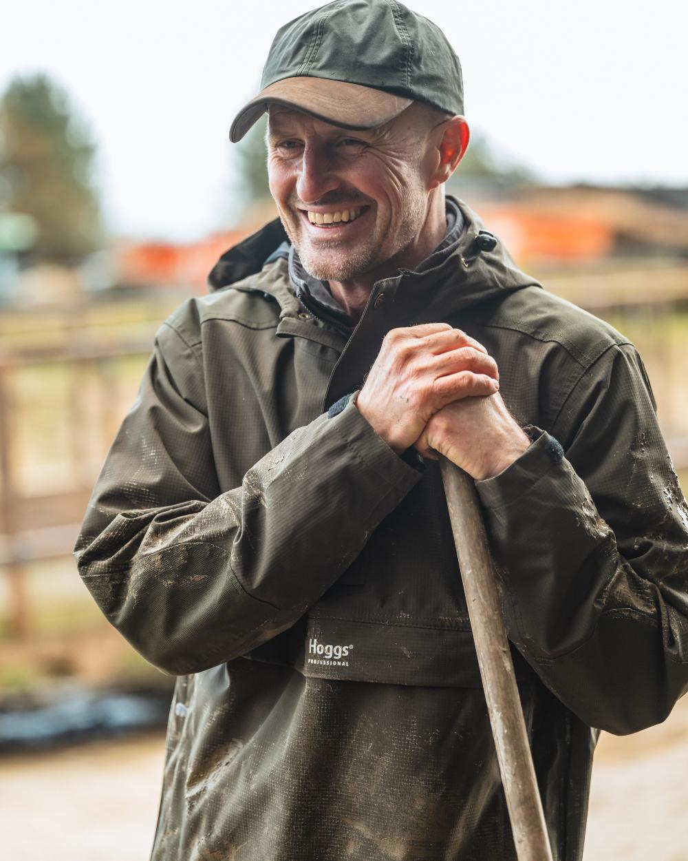 Green Coloured Hoggs of Fife Green King II Waterproof Smock on blurry background #colour_green