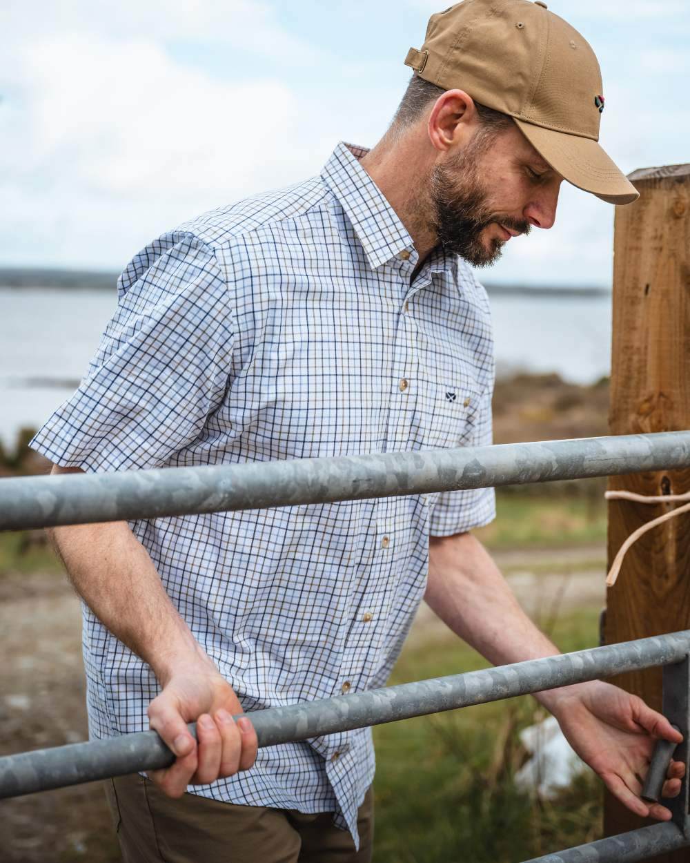Brown Blue Coloured Hoggs of Fife Kessock Tattersall Short Sleeved Shirt on coastal background #colour_brown-blue