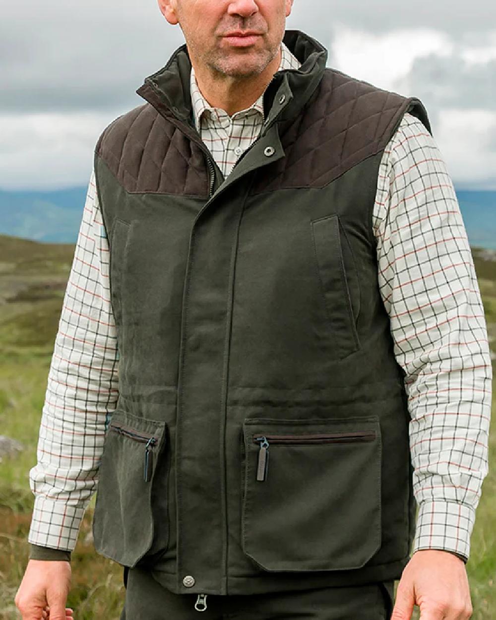 Olive Green Coloured Hoggs of Fife Kincraig Field Waistcoat on sky background #colour_olive-green