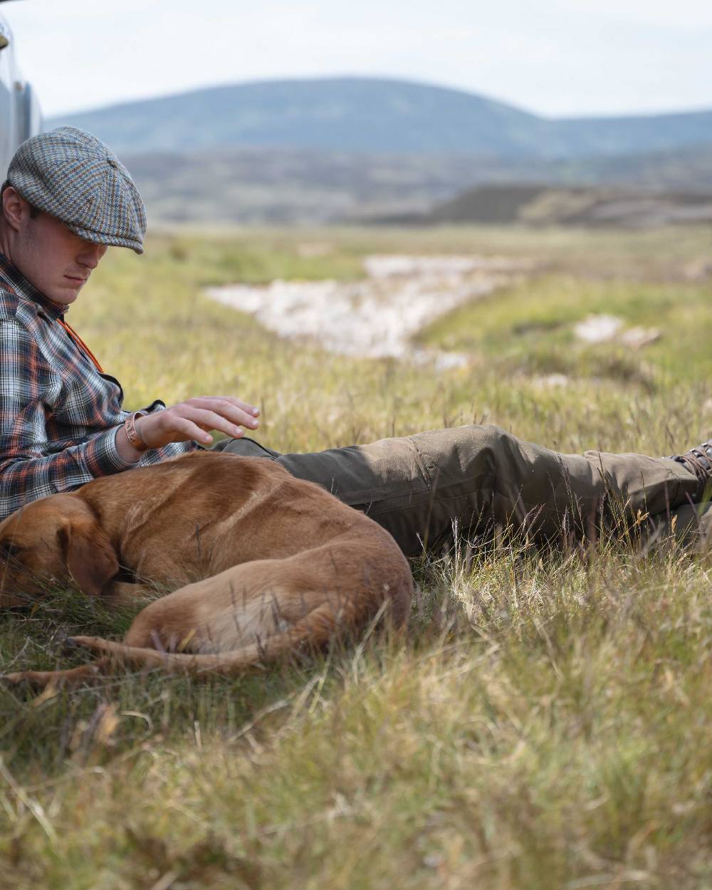 Olive Green Coloured Hoggs of Fife Kincraig Waterproof Field Trousers on outdoor background #colour_olive-green