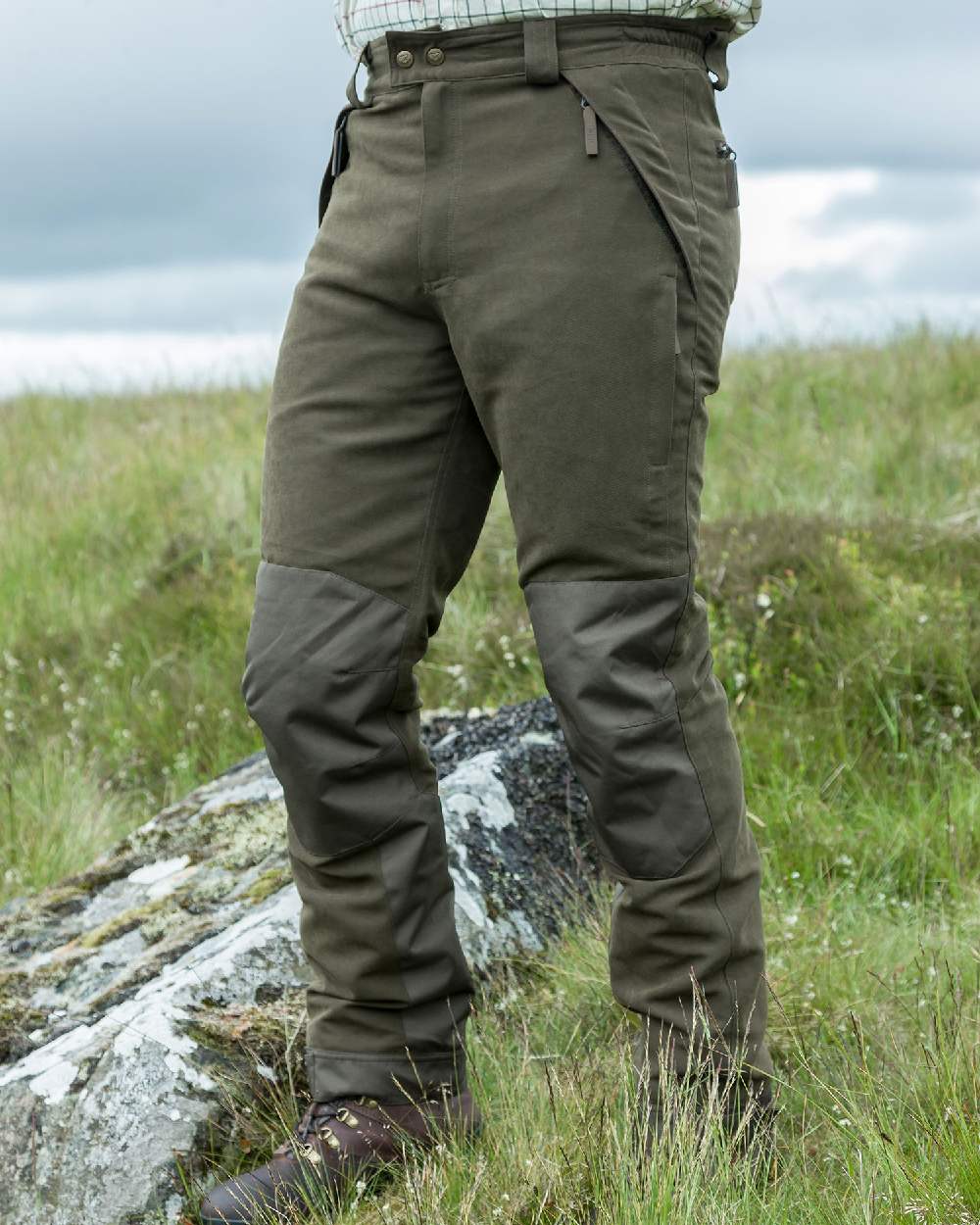 Olive Green Coloured Hoggs of Fife Kincraig Waterproof Field Trousers on land background #colour_olive-green