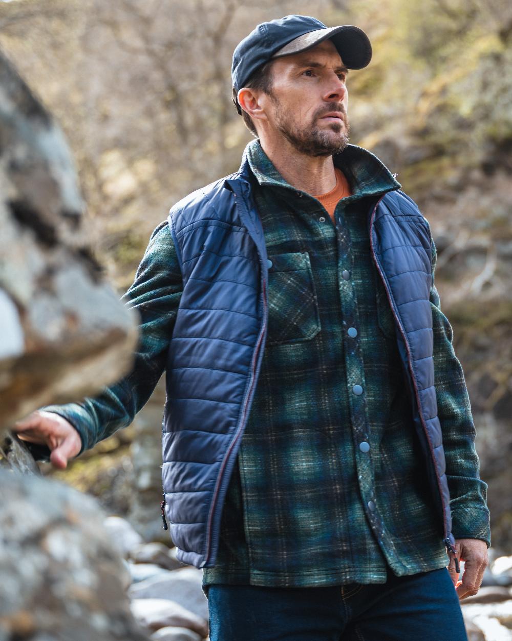 Navy Merlot coloured Hoggs of Fife Kingston Rip-Stop Gilet on mountain background #colour_navy-merlot