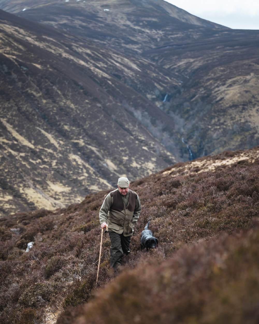 Autumn Bracken Coloured Hoggs of Fife Kinloch Technical Tweed Field Waistcoat on mountain background #colour_autumn-bracken