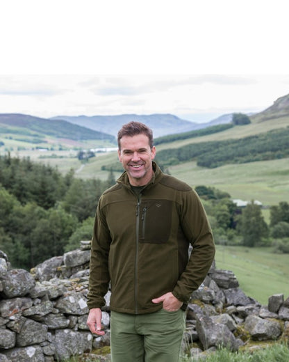 Green Brown Coloured Hoggs of Fife Kinross II Waterproof Field Jacket on mountain background #colour_green-brown