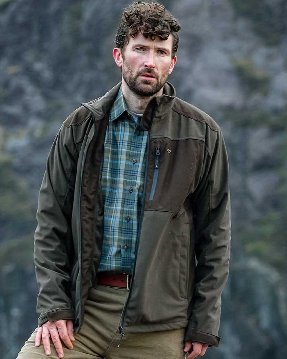 Green Brown Coloured Hoggs of Fife Kinross II Waterproof Field Jacket on blurry background #colour_green-brown