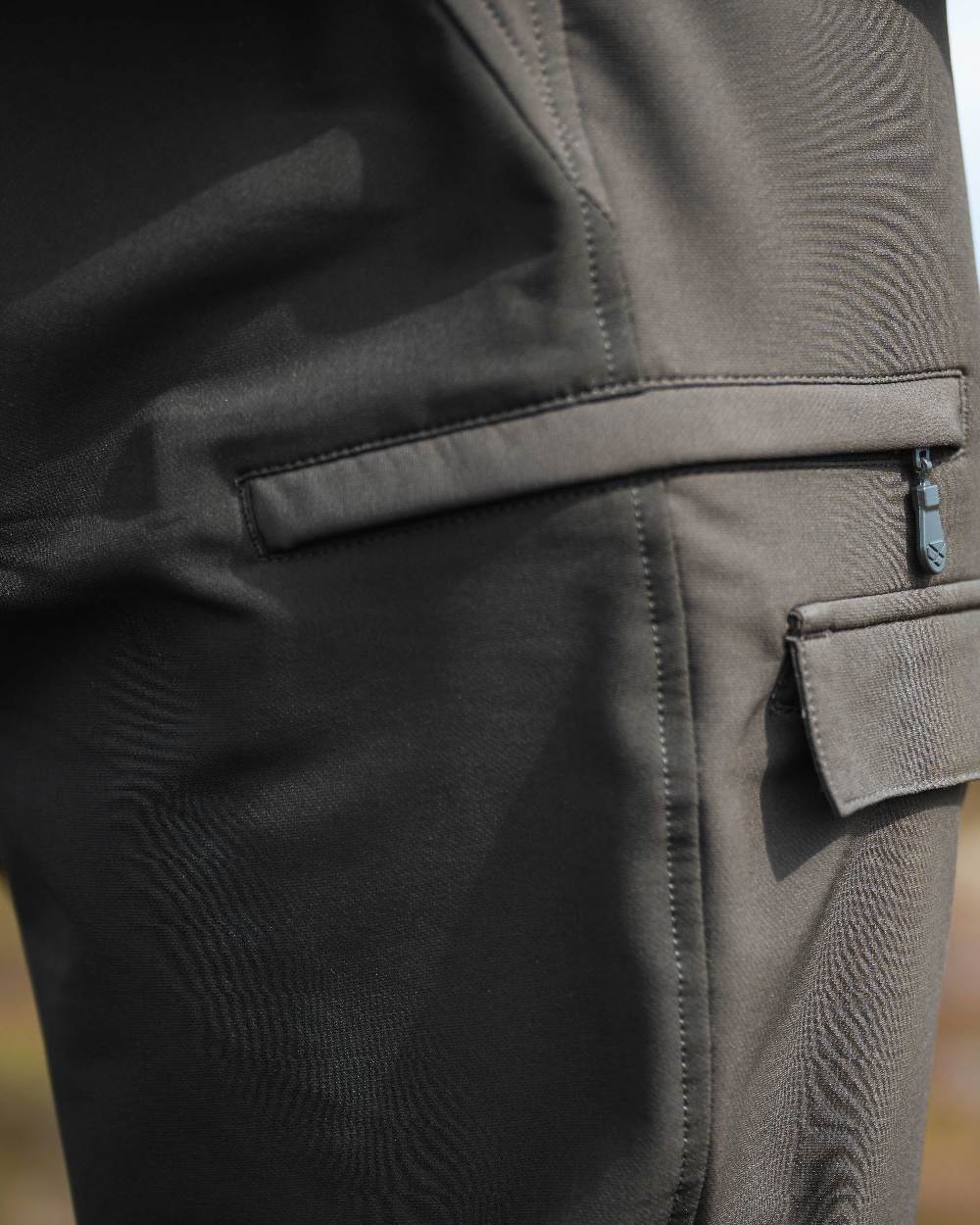 Green Coloured Hoggs of Fife Mens Ardross 4 Way Active Trousers on blurry background #colour_green