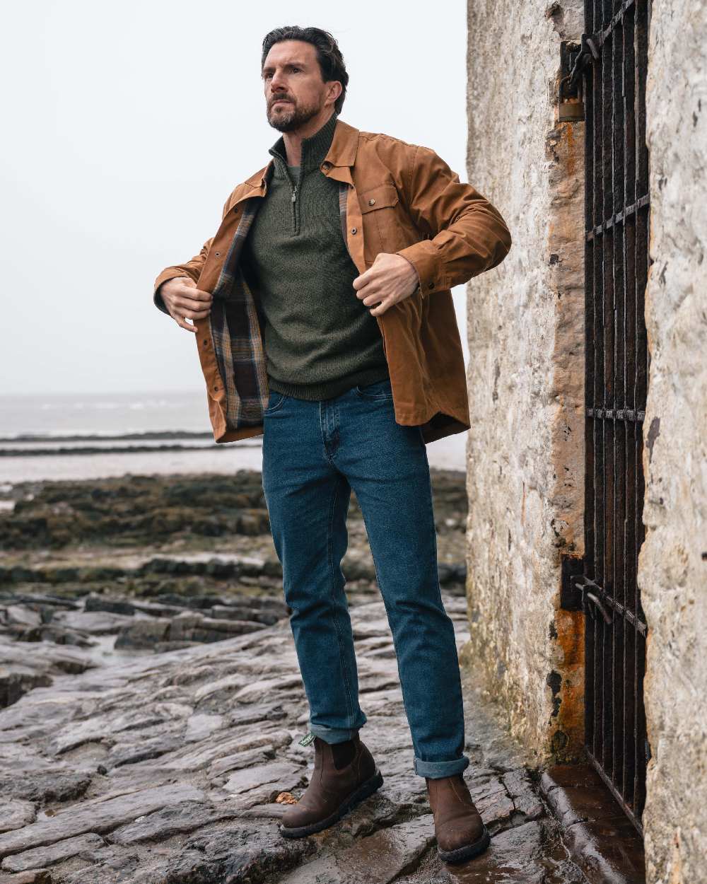 Caramel coloured Hoggs of Fife Mens Huntly Waxed Canvas Utility Overshirt on coastal background #colour_caramel